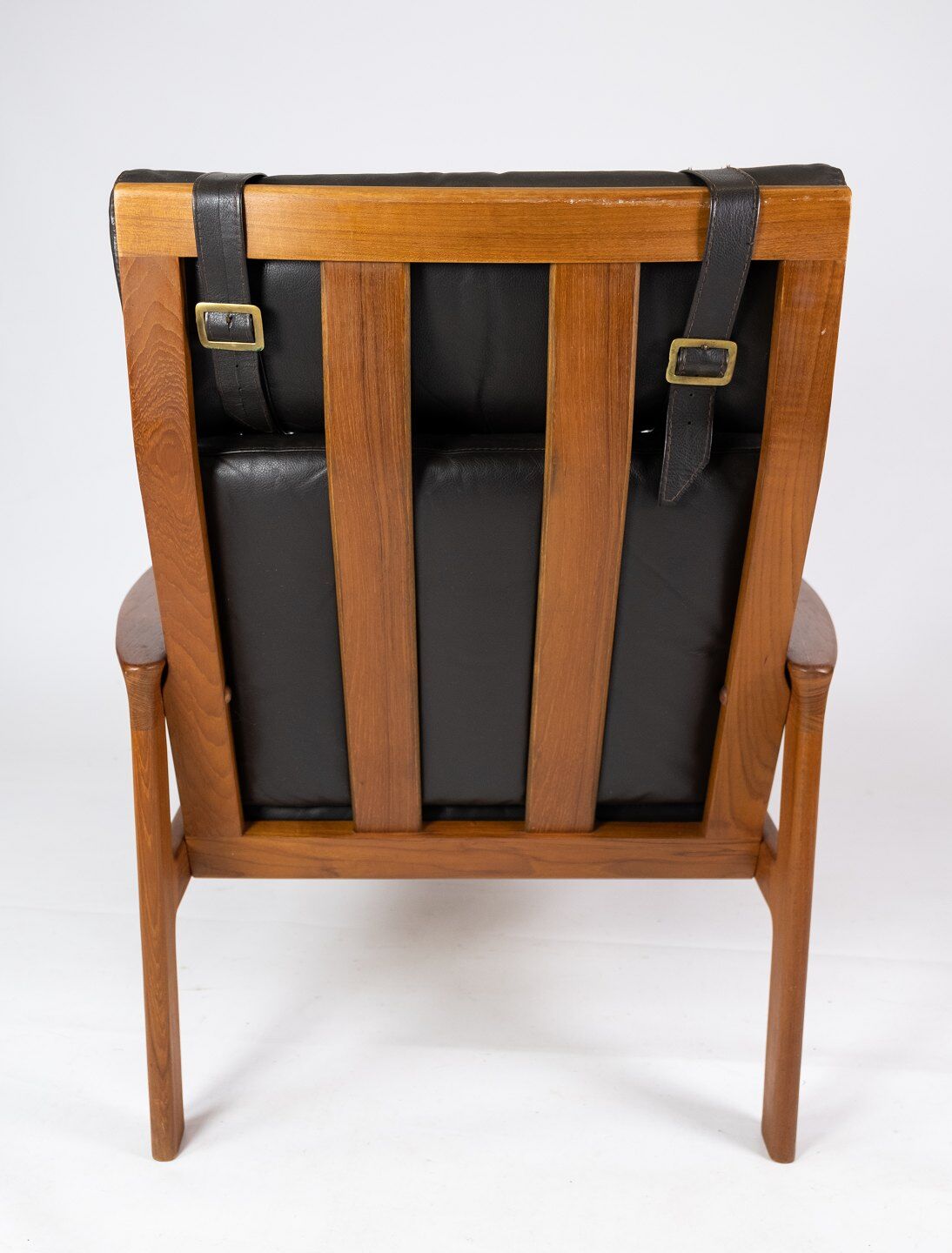 Easy chair with stool in teak upholstered with black leather design Arne Wahl Iversen