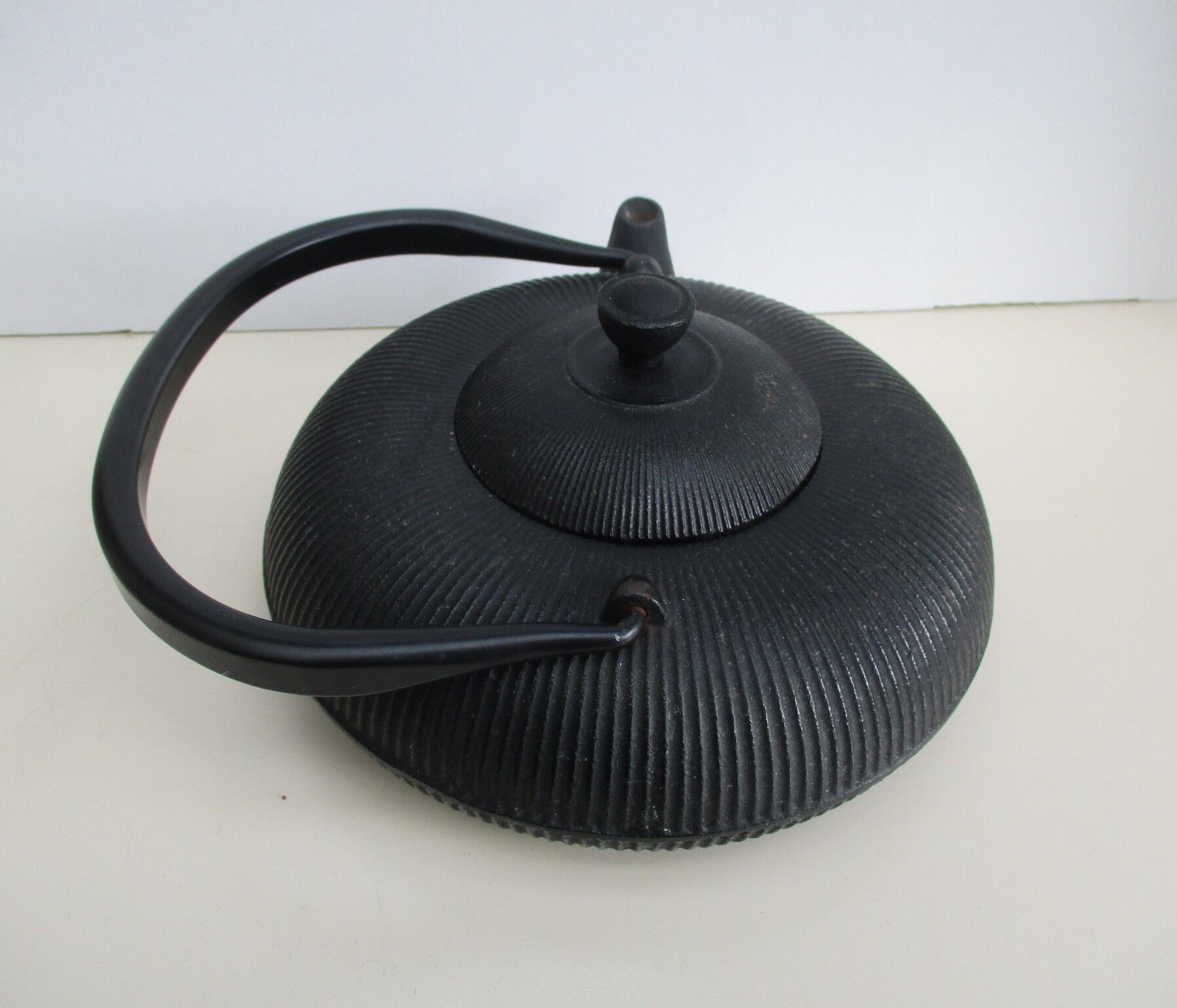 Asian teapot in black cast iron