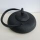 Asian teapot in black cast iron
