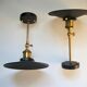 Pair of metal wall lamps in black and bronze color