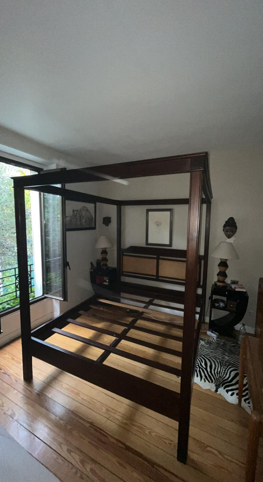 Exotic wood four-poster bed colonial style with rattan headboard
