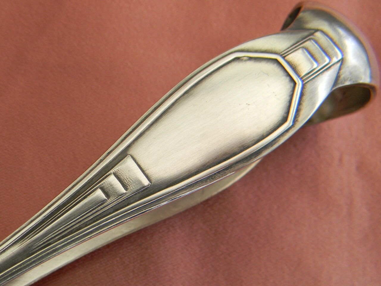 Art deco sugar tongs in silver metal