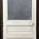 Old door from 1890 in solid wood with translucent glass at the top