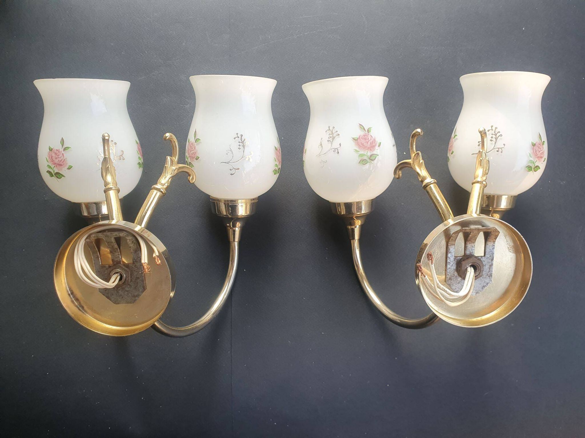Pair of vintage wall sconces in gilded brass and pink opaline glass.