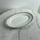 Oval presentation plate Saint Amand with bicolour floral decoration.