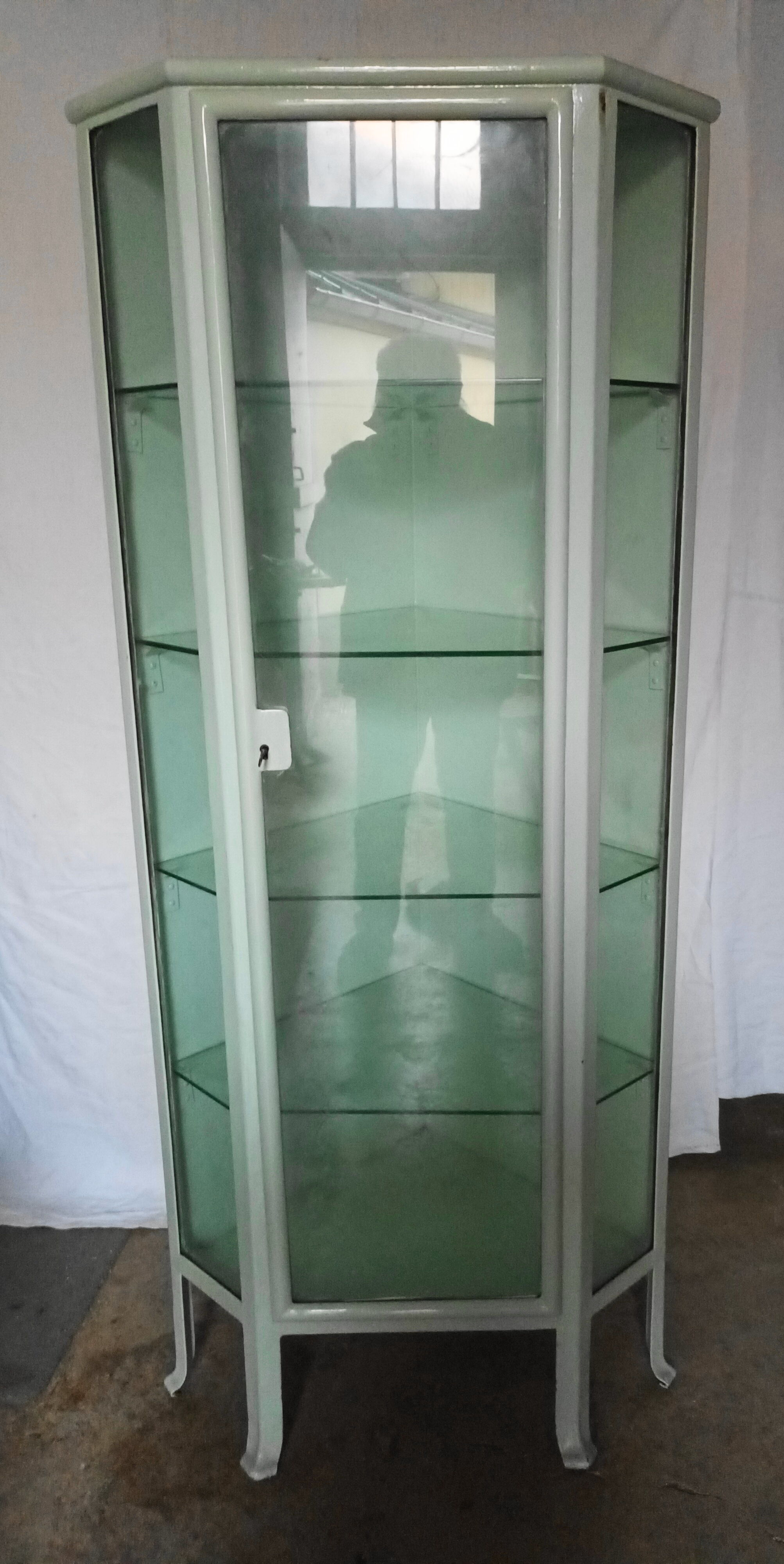 Painted metal ophthalmologist's corner display case, early 20th century