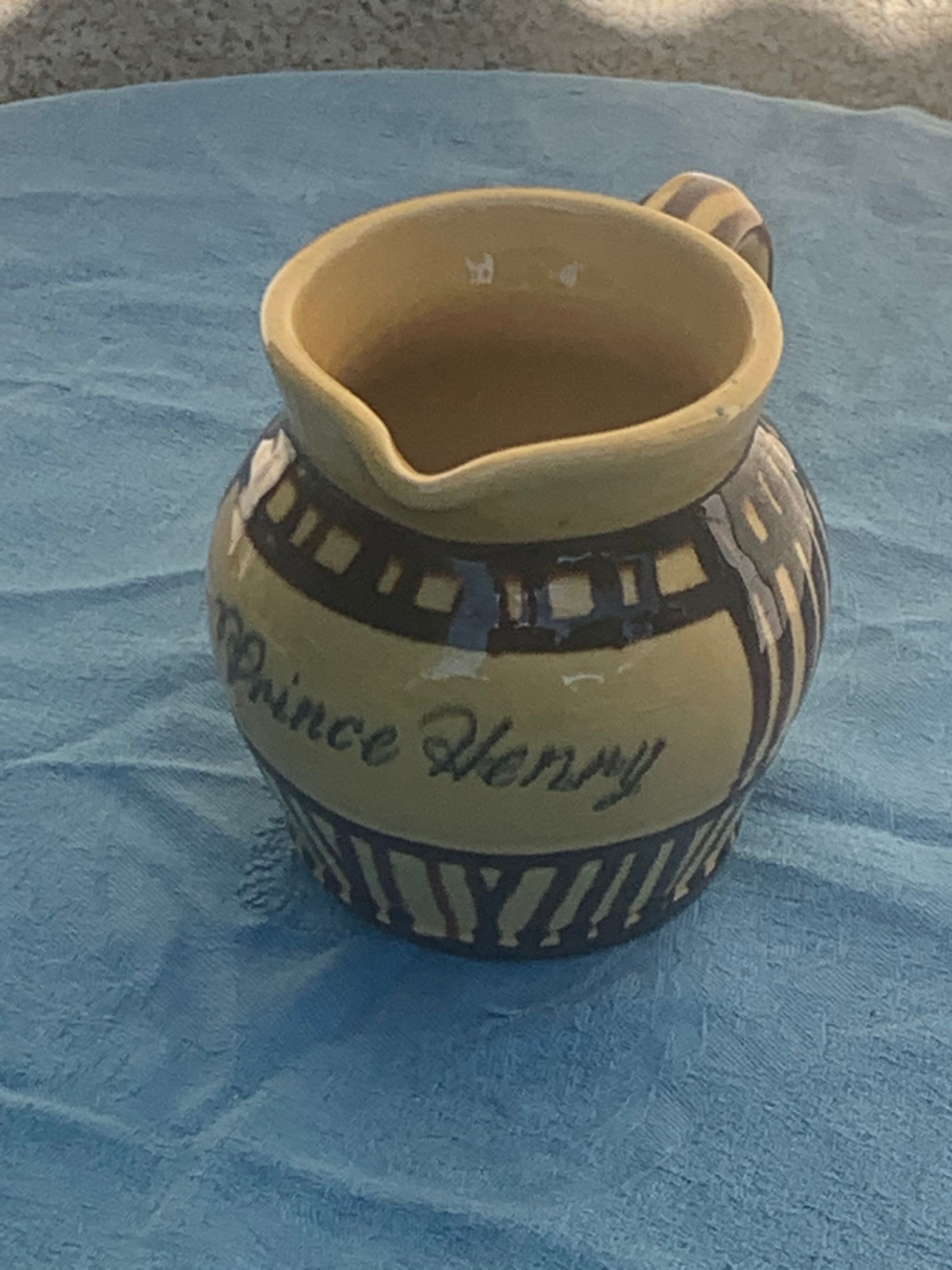 Vintage prince henry enamelled ceramic pitcher
