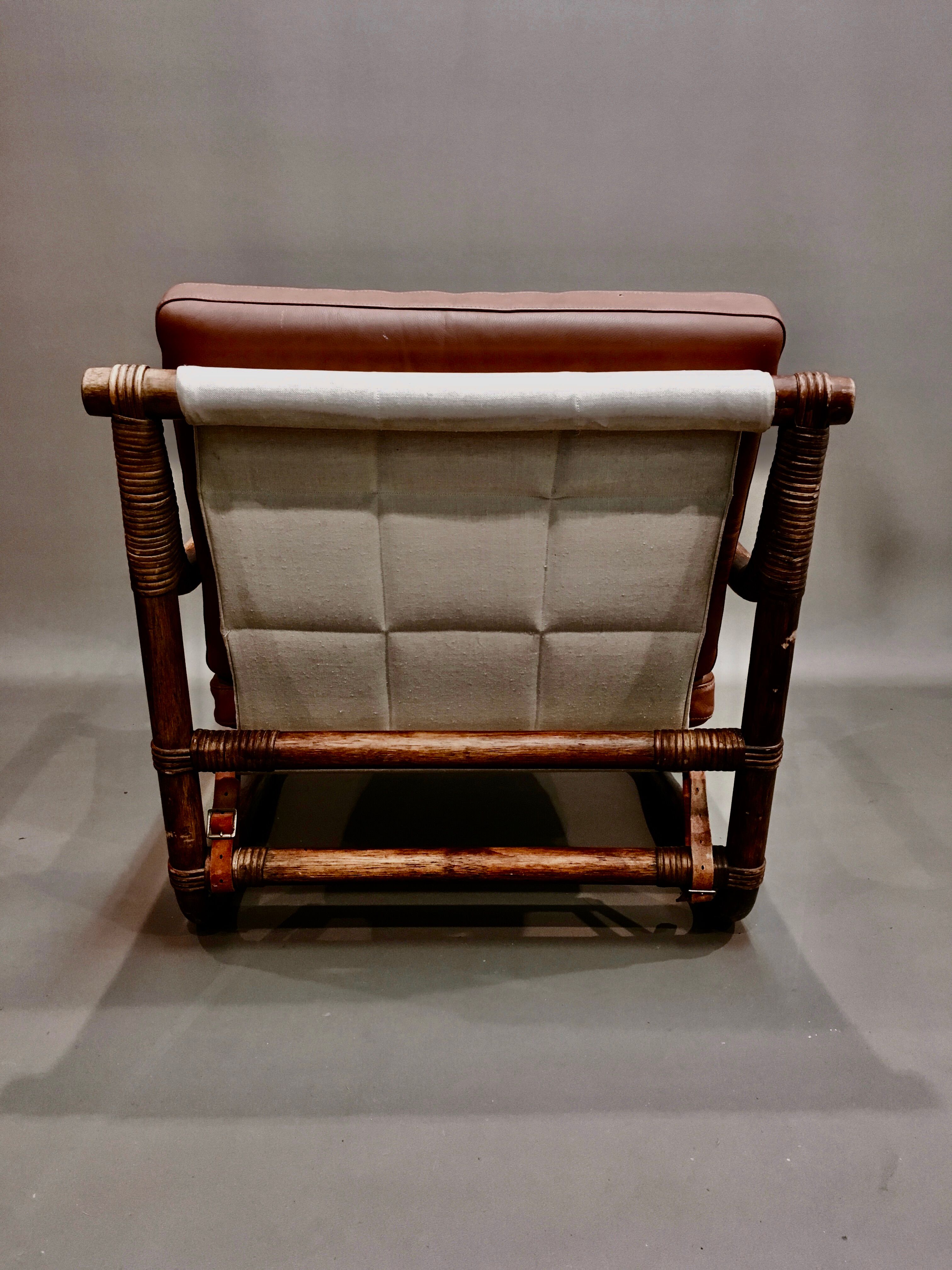 Fauteuil et son ottoman rotin et cuir 1950