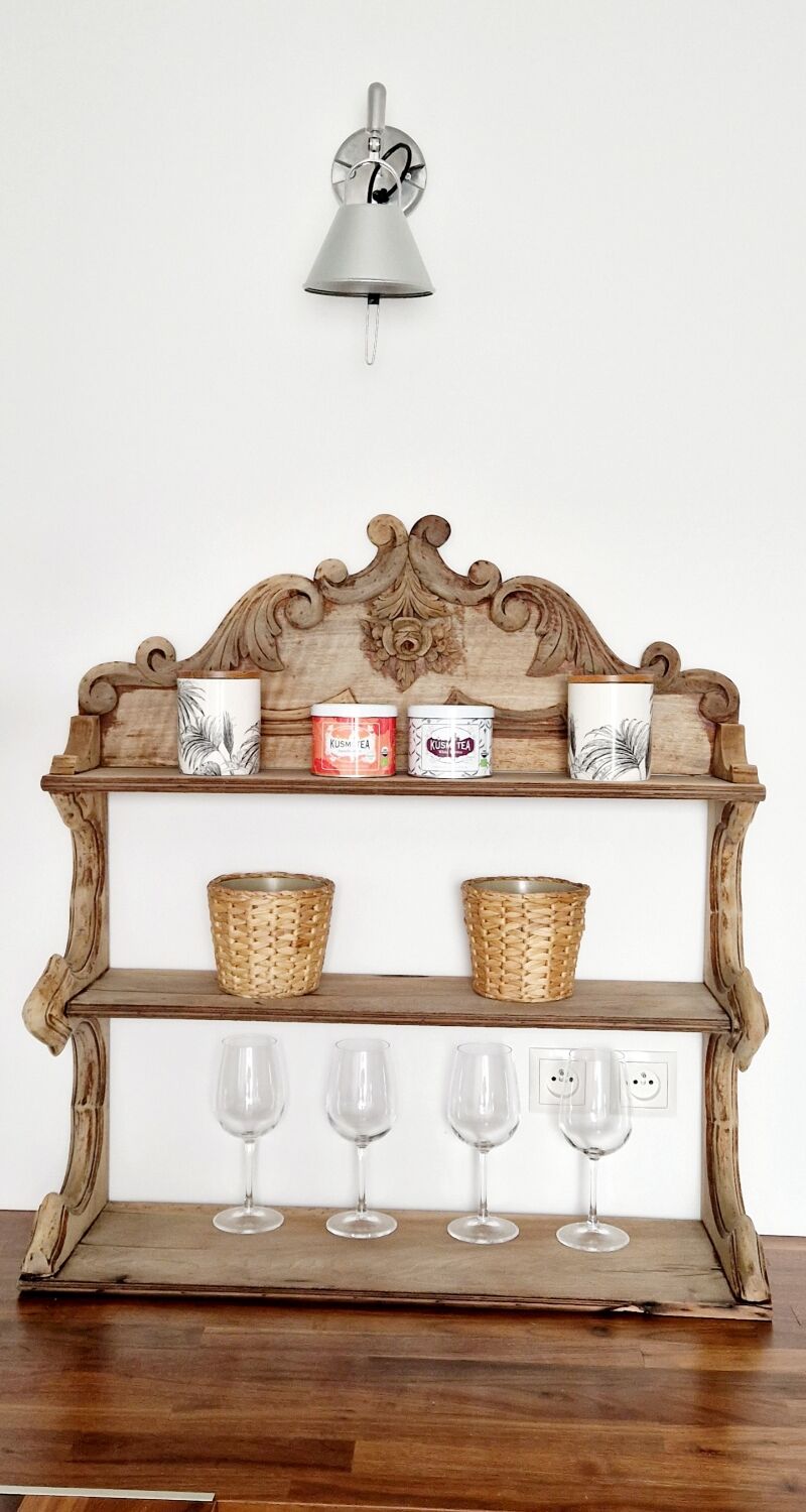 Old wall shelf carved in walnut