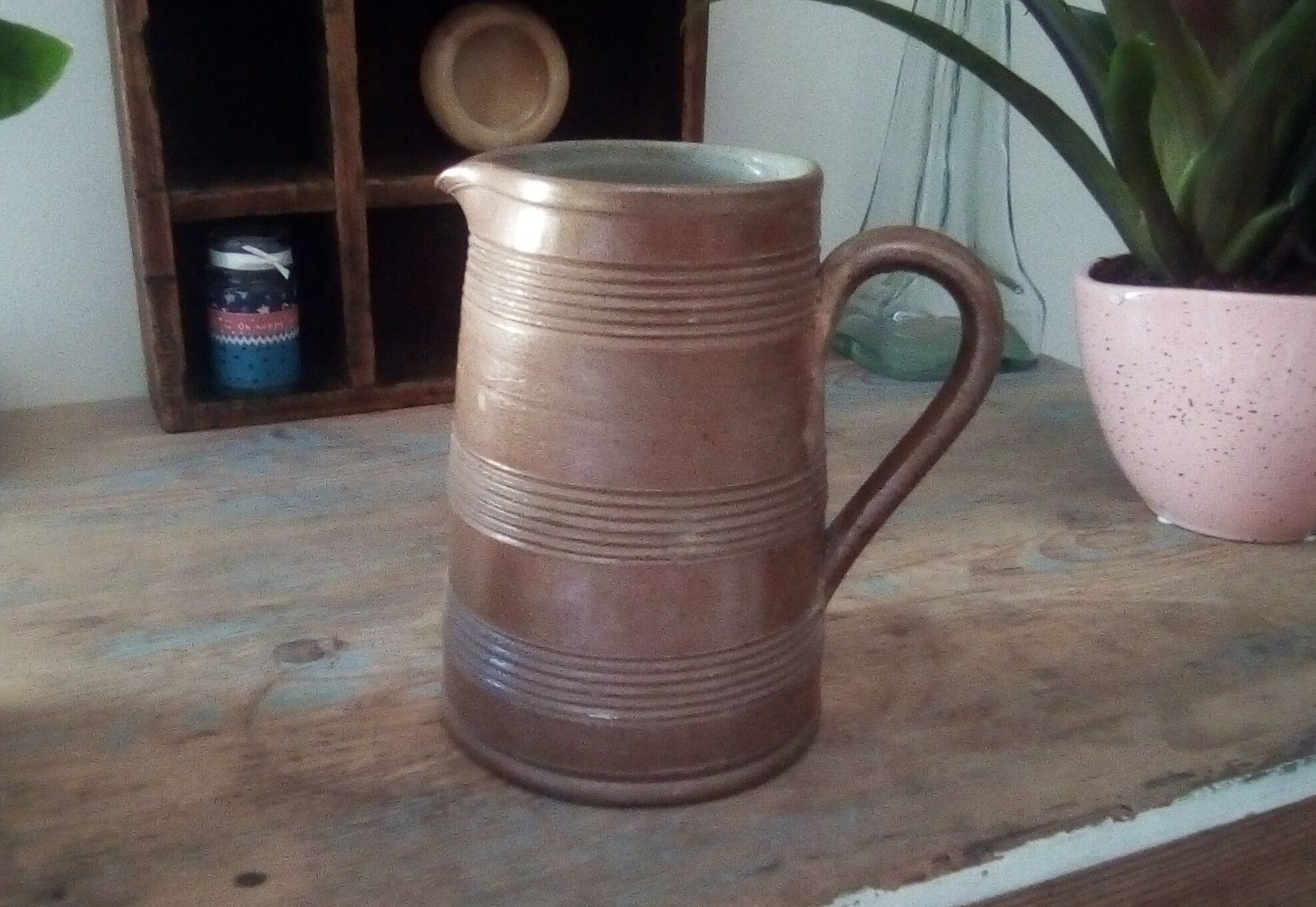 Vintage pitcher in glazed sandstone