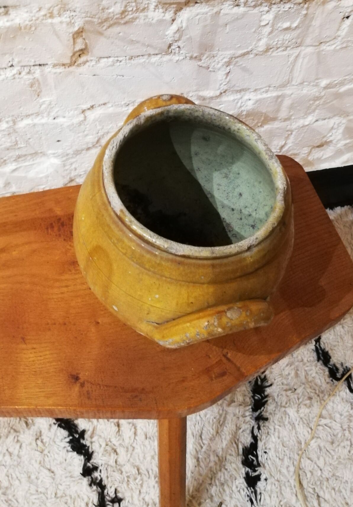 Old yellow glazed terracotta pot