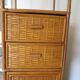 Storage column, wooden bookshelf and woven rattan.