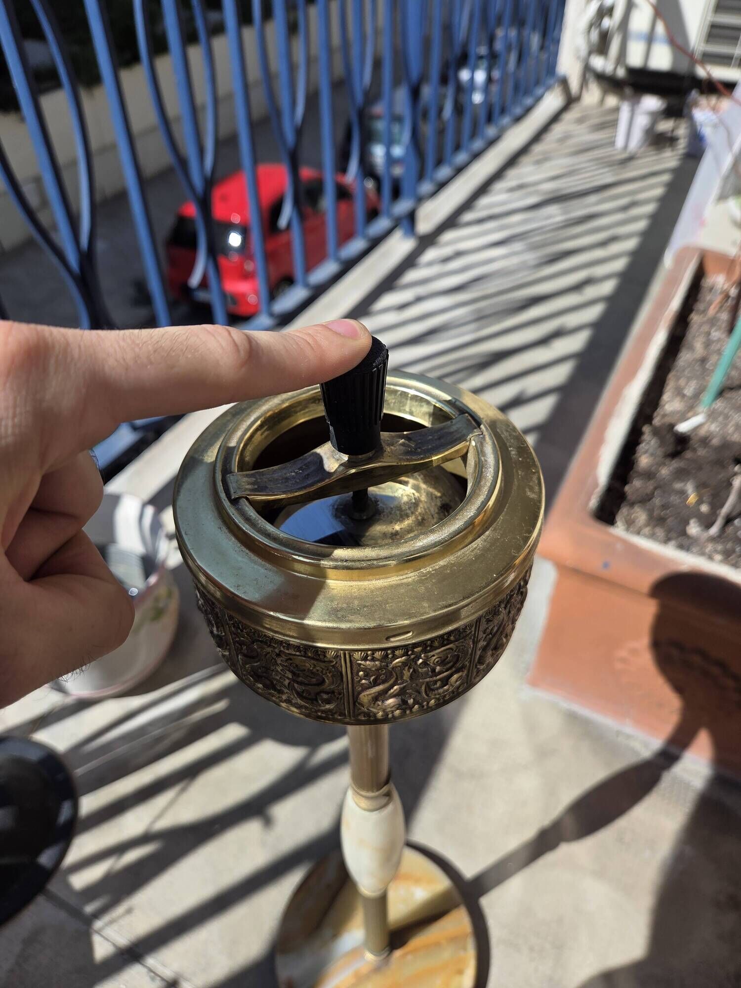 Floor ashtray in gilded brass (frieze of fish)