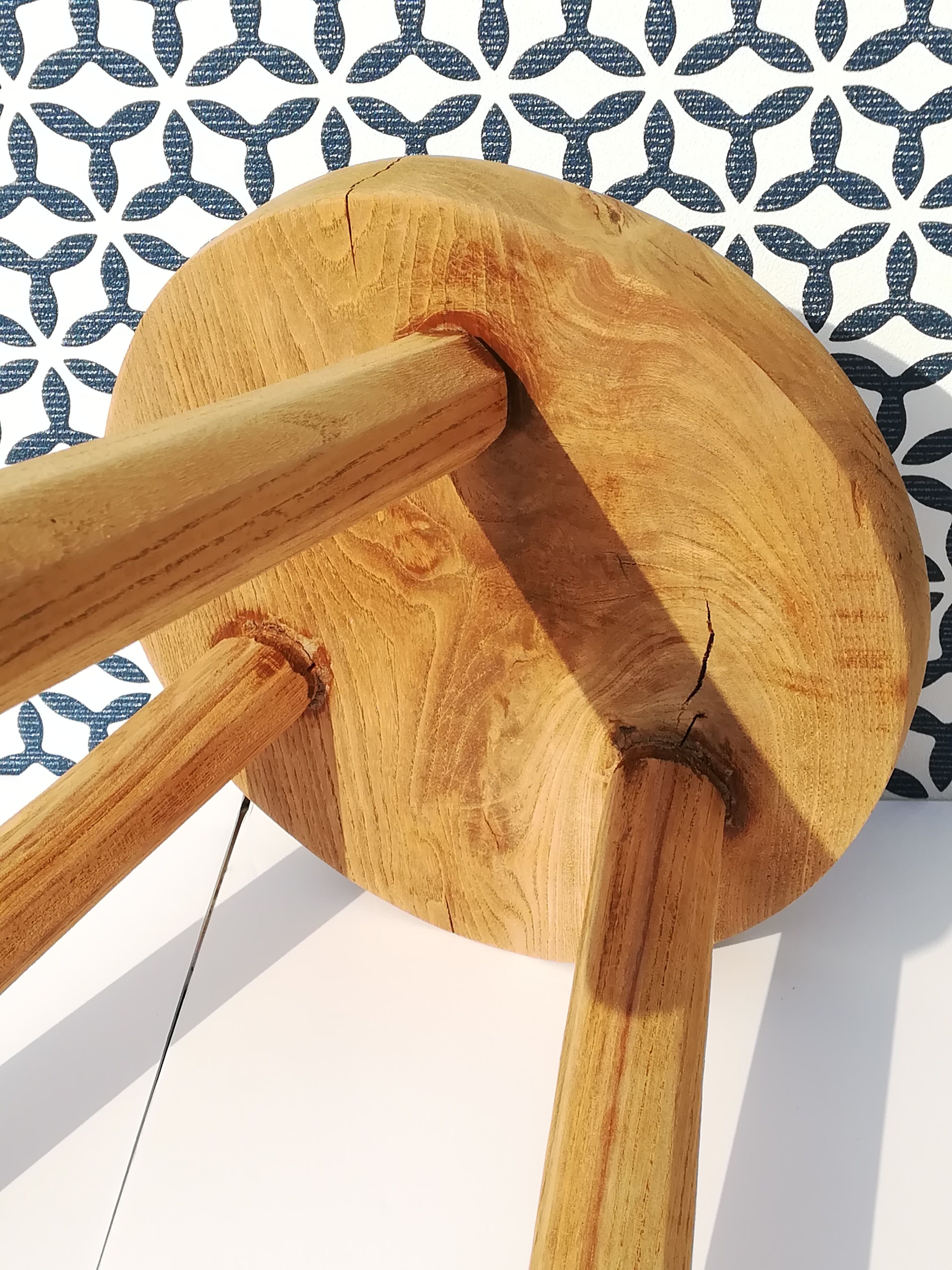 Crude wooden tripod stool