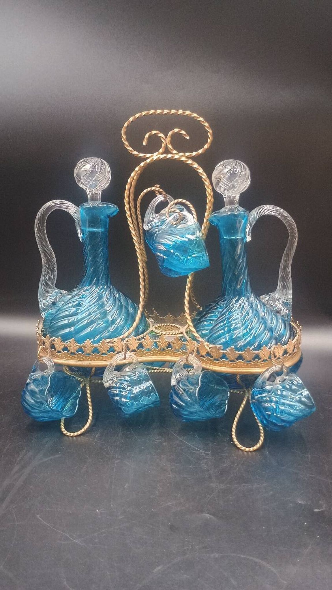 Cabaret Portieux liqueur service with 10 blue and clear glasses.