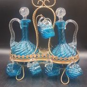 Cabaret Portieux liqueur service with 10 blue and clear glasses.