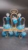 Cabaret Portieux liqueur service with 10 blue and clear glasses.
