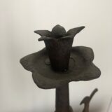 Old and patinated metal candlestick