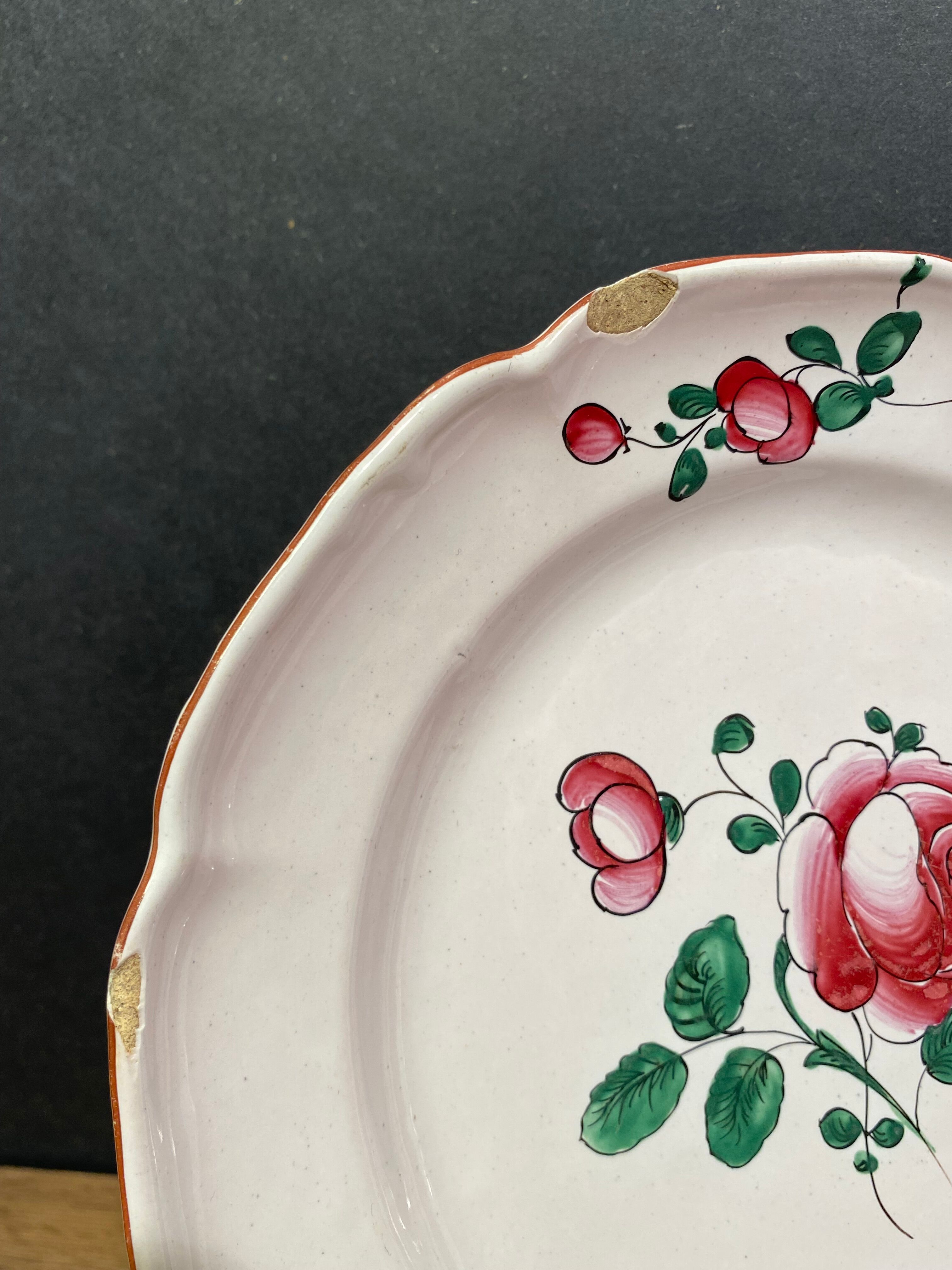 Pair of earthenware plates from the East nineteenth with floral decoration