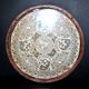 Antique lace top under glass and gilded stucco frame