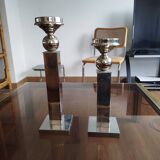 Pair of designer candlesticks in chromed metal.