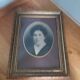 Old photo portrait framed in wood and stucco