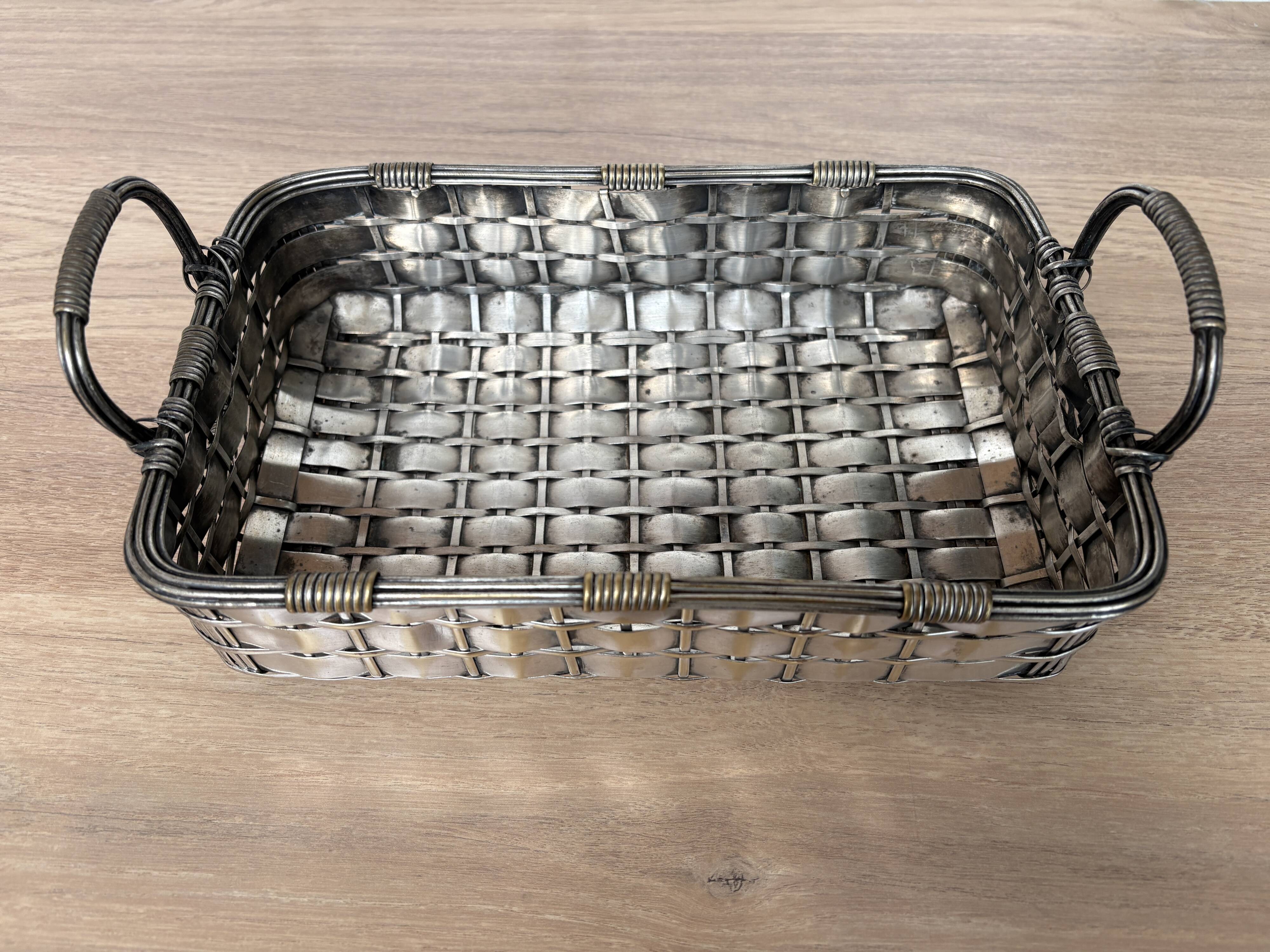 Woven silver-plated metal basket.