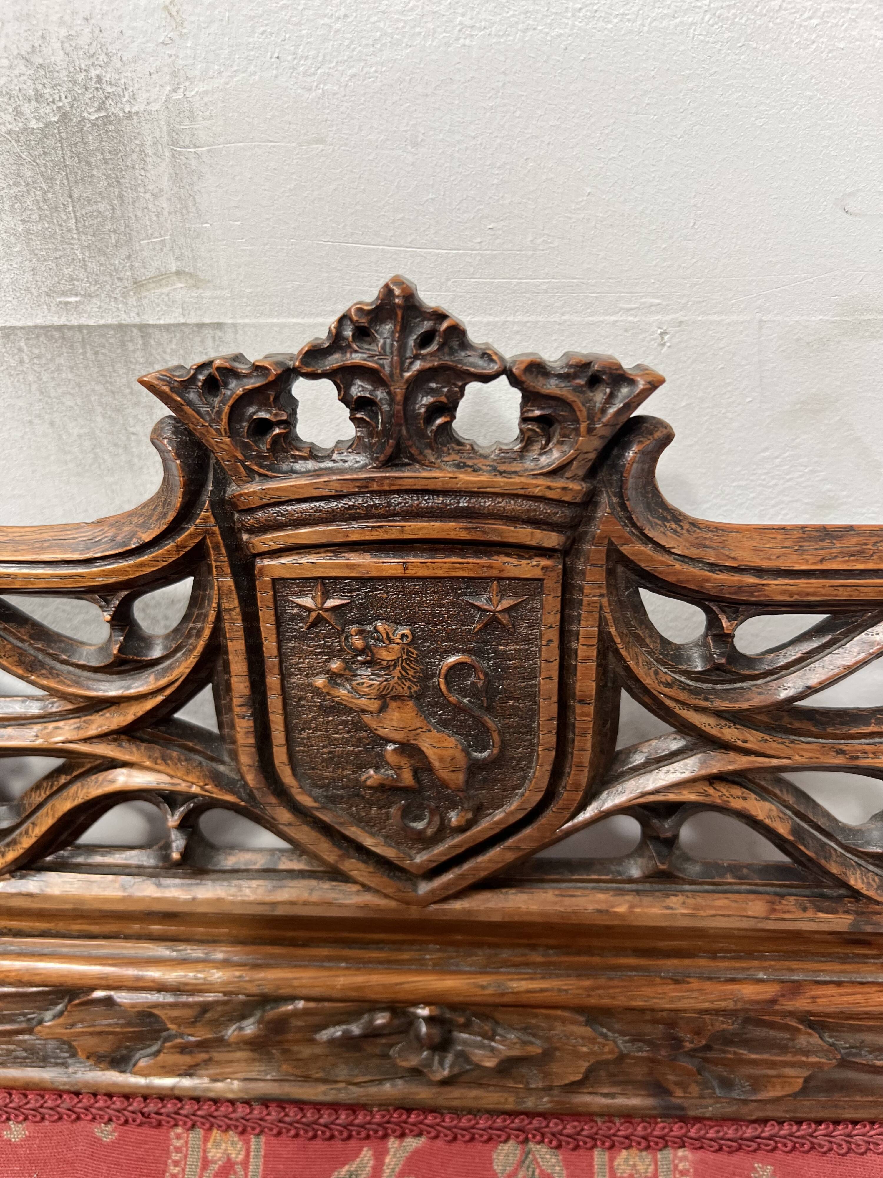 Pair of Gothic-style walnut lounge chairs, 19th century