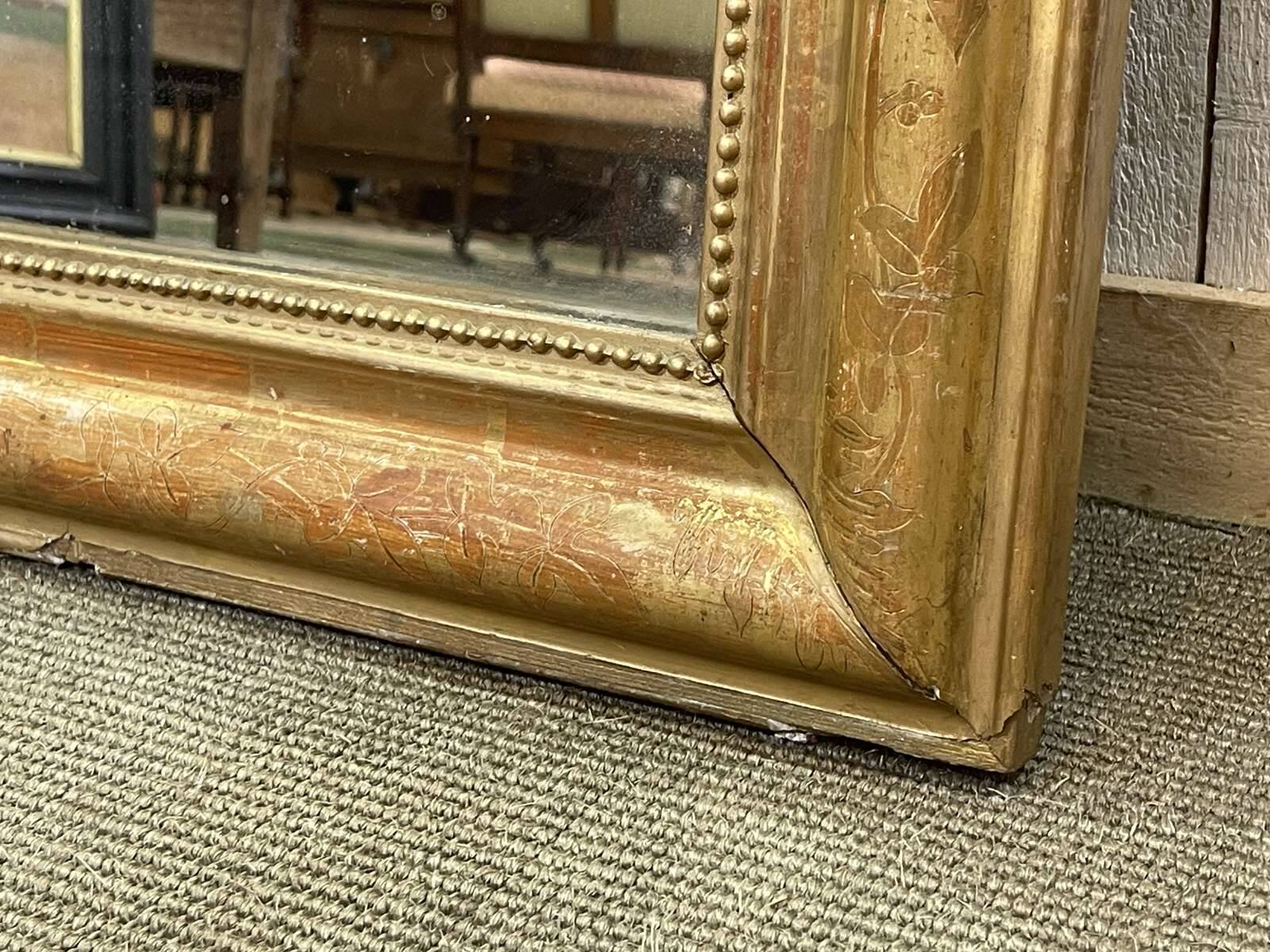 Miroir Louis XV fin XIXème en bois doré