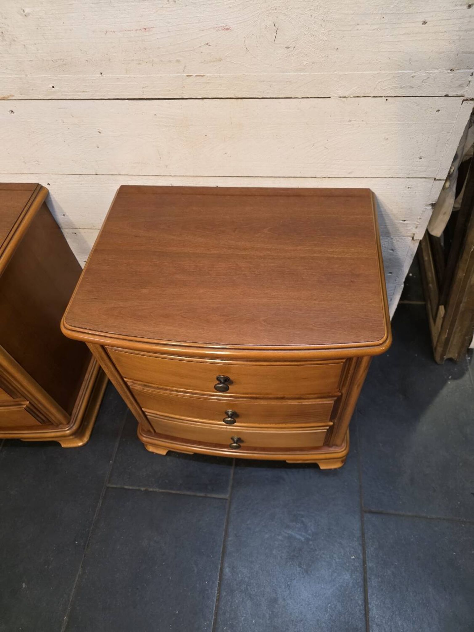 Pair of Louis Philippe style bedside tables in cherry wood.