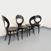 Set of 4 vintage Mouette chairs by Baumann in black wood from the 1960s.