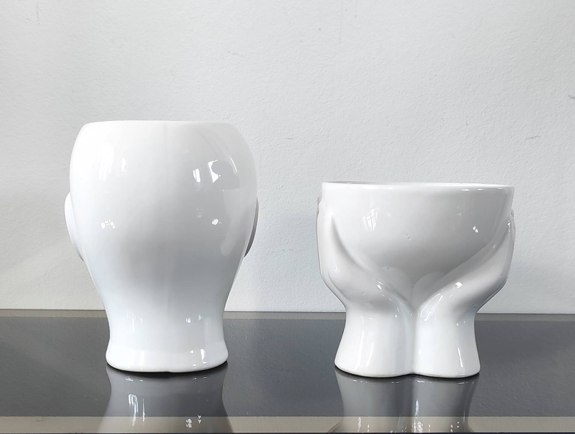 A pair of vintage ceramic plant pots.