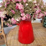 Ancient pitcher in red enamelled sandstone