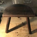 Wooden milking stool on tripod base