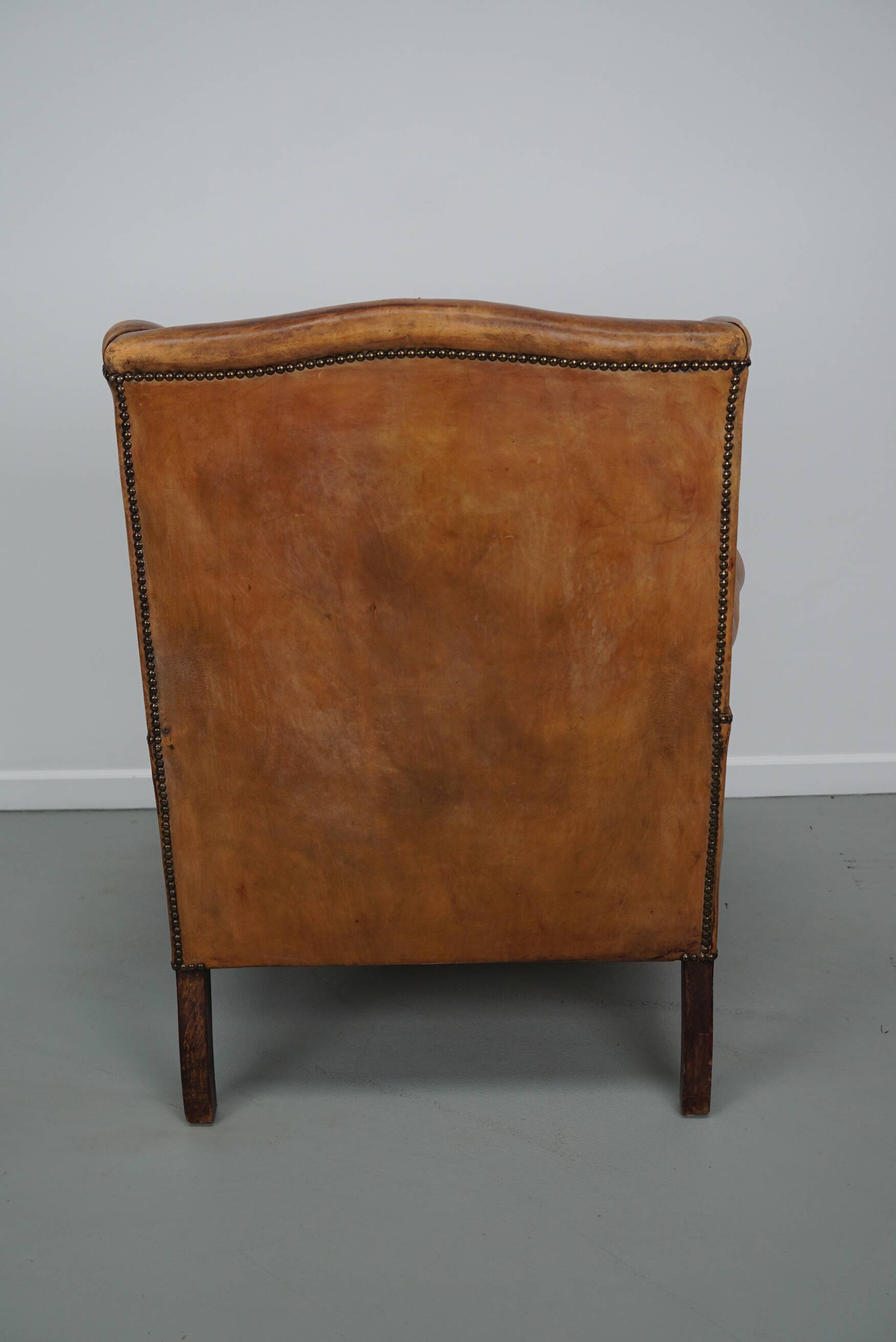 Vintage Dutch cognac coloured leather club chair, with footstool
