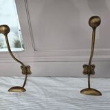 Coat rack or wall-mounted entrance wardrobe with scroll arms and antique hooks.