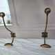 Coat rack or wall-mounted entrance wardrobe with scroll arms and antique hooks.