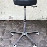 Stool on metal stand in star on wheels sitting round padded skaï bluish