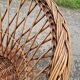 Old throne basket armchair in woven wicker