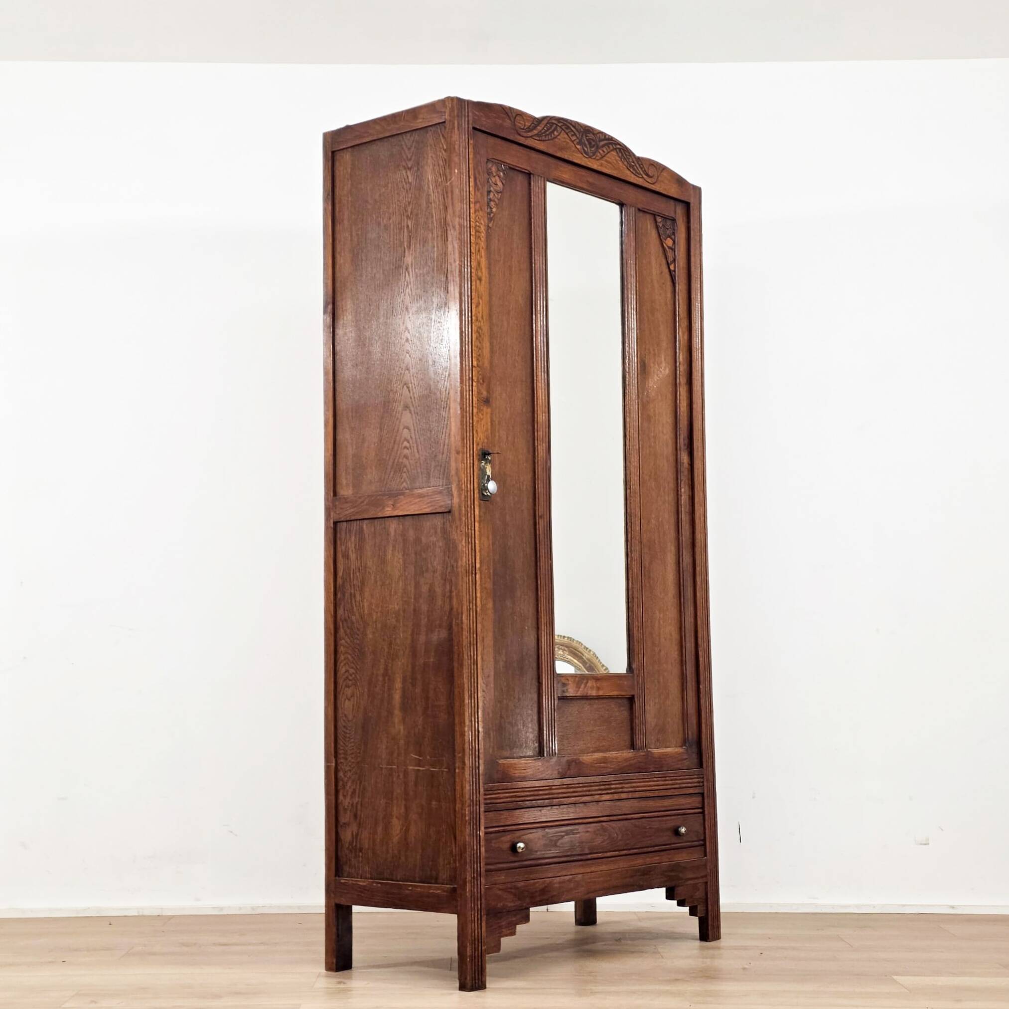 Art Deco wardrobe in solid wood with mirror from the 1920s.