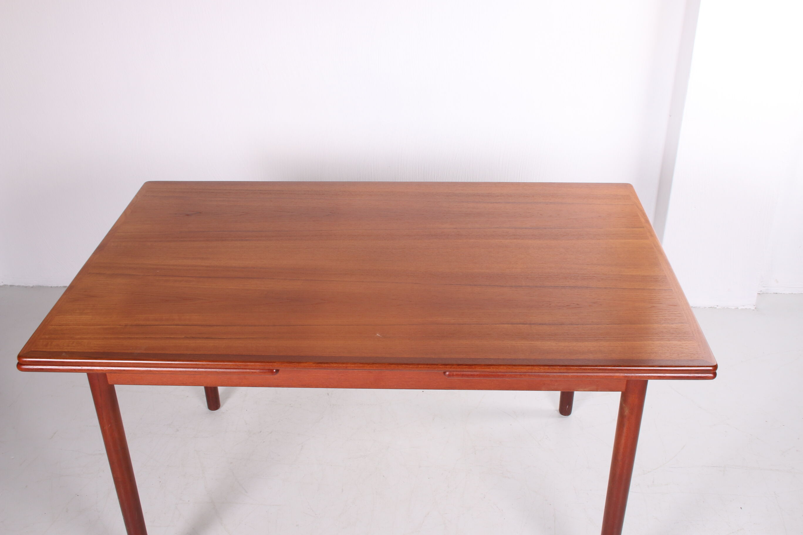 Danish teak draw-leaf dining table