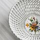 Openwork porcelain fruit bowl.