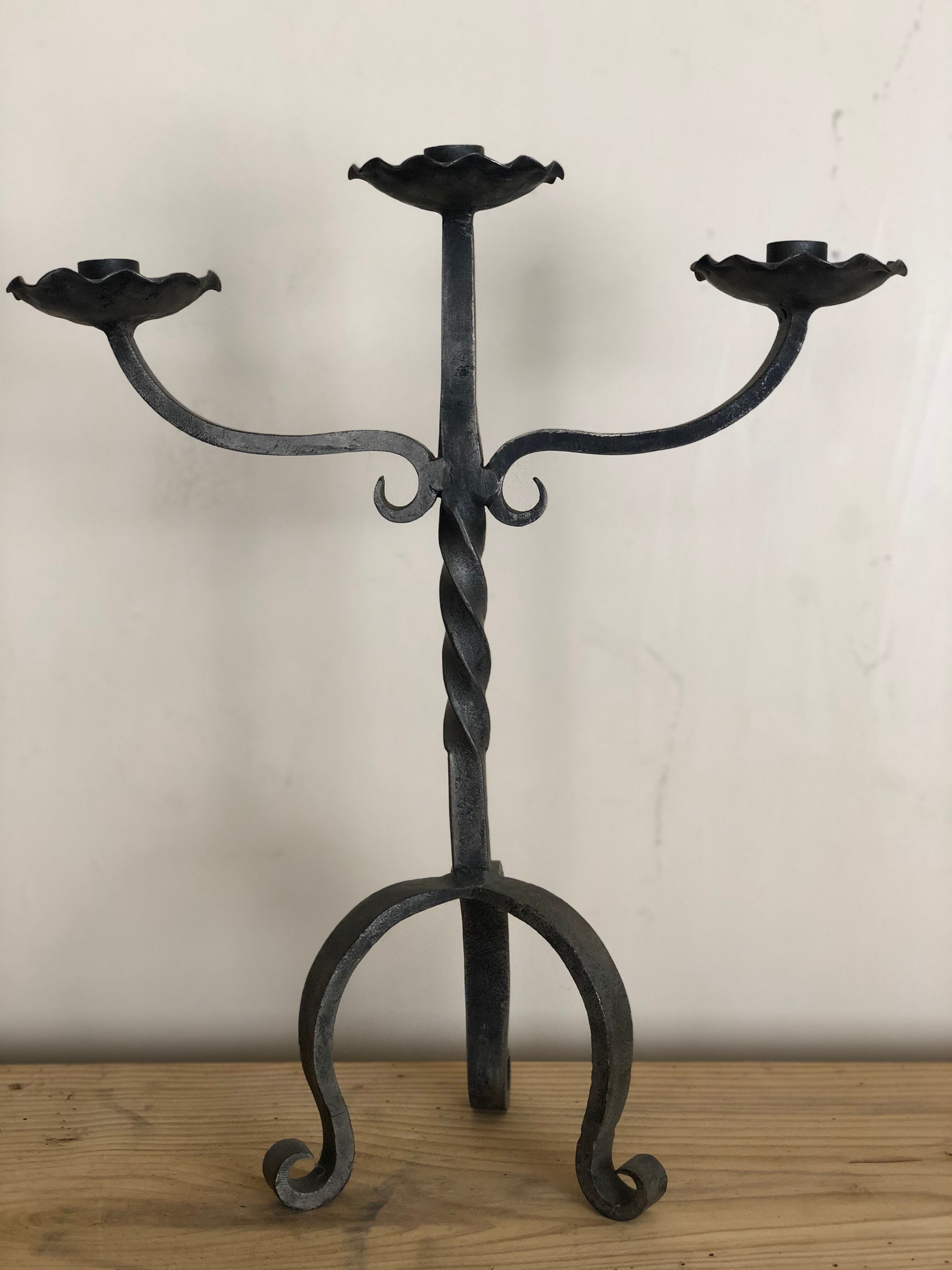 Pair of wrought iron candlesticks