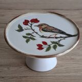 Cake display on pedestal with bird decor