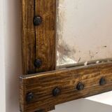 Brutalist mirror with a hammered copper and brass frame.