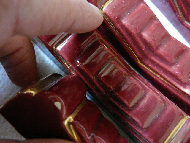 together 12 carries knives and a red enamelled earthenware bottle