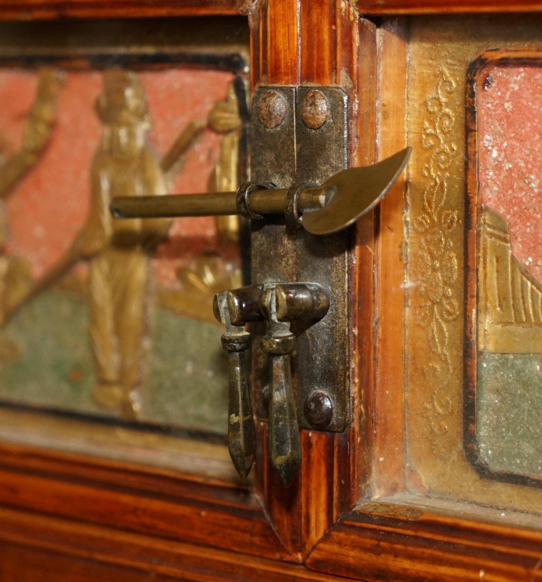 Antique Chinese armoire hand-carved around 1880 with country-style handles.