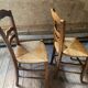 2 wooden chairs with cane