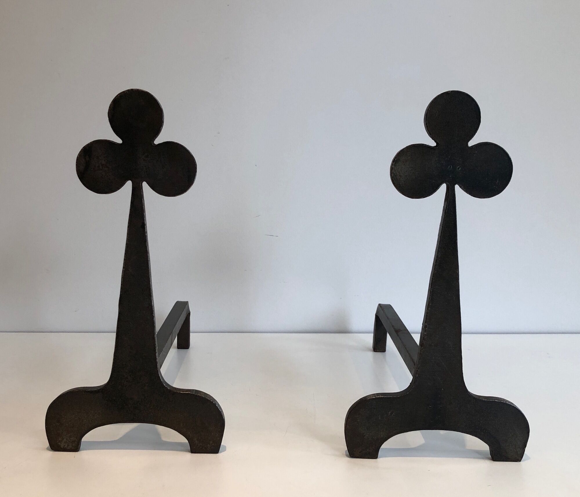 Pair of wrought steel and iron chenets with clover decorations 1950