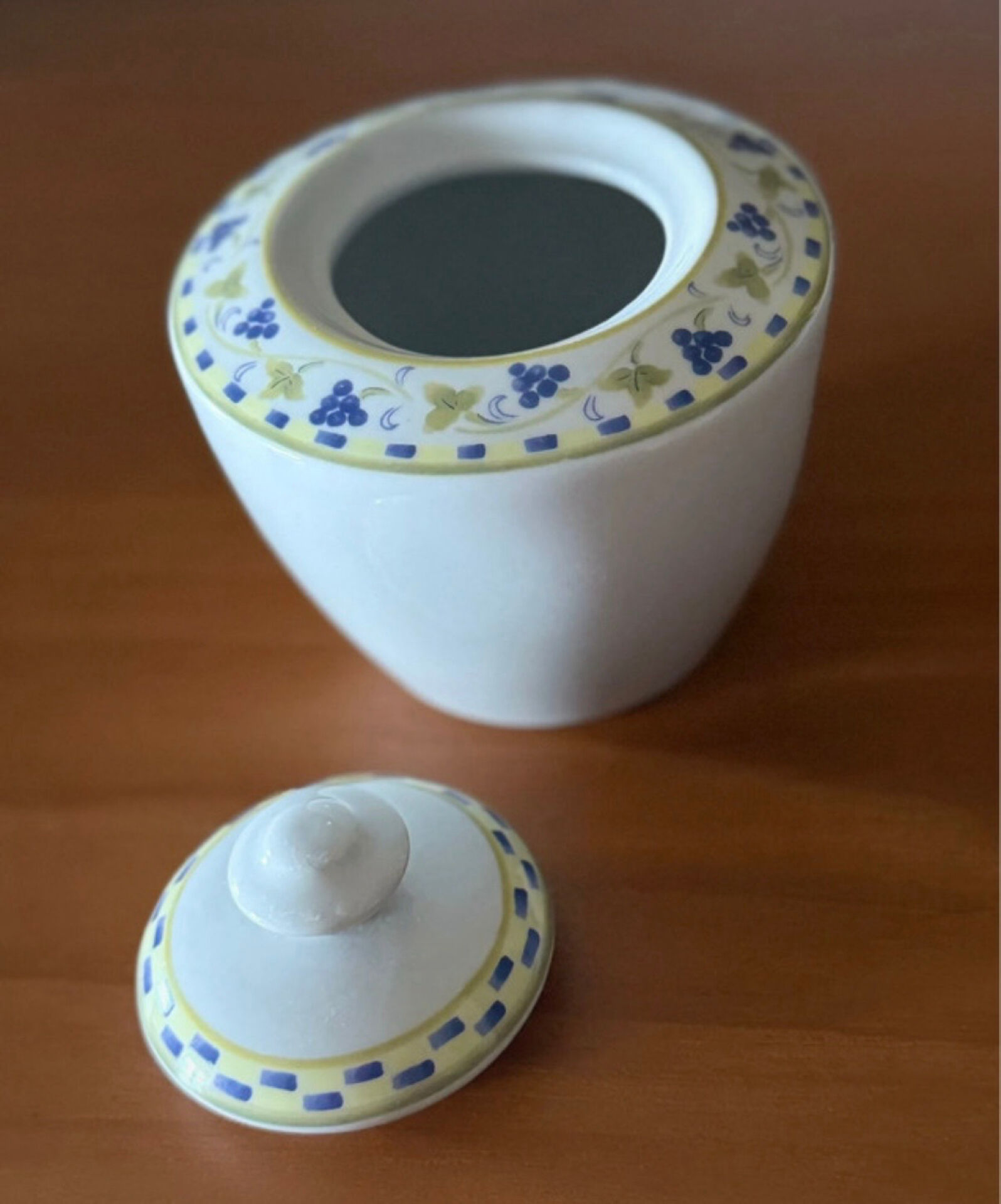 Fine porcelain sugar bowl from Bavaria with a grape design.
